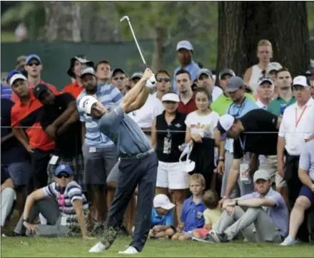  ?? CHRIS O’MEARA — THE ASSOCIATED PRESS ?? Third-round leader Kevin Kisner hits from the rough on the third hole at the PGA Championsh­ip at the Quail Hollow Club in Charlotte, N.C. on Saturday.