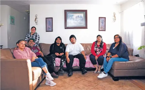  ?? BETH COLLER/THE NEW YORK TIMES ?? The Vega family at their home in San Bernardino, Calif., last month. Sisters Danae, right, and Ashley, back left, Vega were the ones to purchase the $331,000 three-bedroom, two-bathroom house on half an acre that the whole family now lives in.