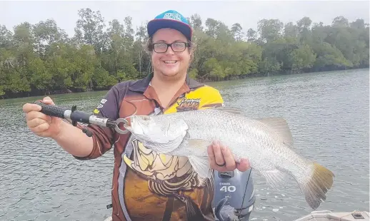  ??  ?? Blake Readett with a 60cm barra caught near Maningrida