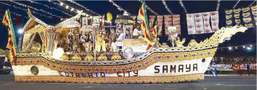  ??  ?? Parade floats from Cotabato City (above) and Quezon (right) highlight diverse cultures and vibrant colors. A masskara-clad dancer leads Bacolod’s entry to the street parade (below).