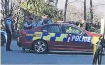  ?? PHOTO: DAISY HUDSON ?? Police arrest a man after a long chase that ended at the BP petrol station in Frankton.