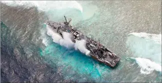  ??  ?? This handout photo taken last Saturday by the Philippine military’s Western Command shows the US Navy minesweepe­r USS Guardian stuck in Tubbataha Reef.