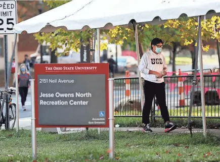  ?? PHOTOS BY FRED SQUILLANTE/COLUMBUS DISPATCH ?? A student prepares to be tested Thursday at the Jesse Owens North Recreation Center on the Ohio State University campus.