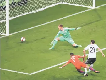  ??  ?? Chile’s Alexis Sanchez (left) scores a goal past Germany goalkeeper Marc-Andre Ter Stegen during their Confederat­ions Cup group B match at the Kazan Arena Stadium in Kazan. — AFP photo