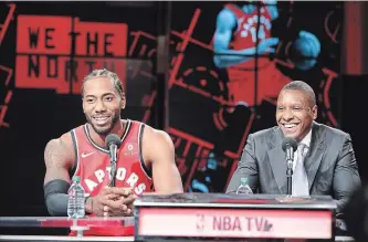  ?? STEVE RUSSELL TORONTO STAR ?? New Toronto Raptors forward Kawhi Leonard, left, and team president Masai Ujiri host the club’s media day Monday before heading to Vancouver for training camp.