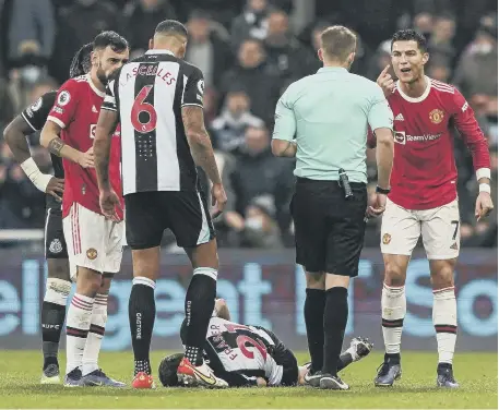  ?? ?? Manchester United’s Cristiano Ronaldo complains to the referee after being shown a yellow card at St James’ Park.