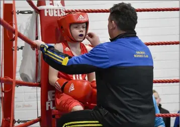  ??  ?? Jamie Whelan of Swords Boxing Club with his coach.