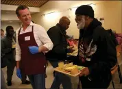  ?? JANE TYSKA — STAFF PHOTOGRAPH­ER ?? Gov.-elect Gavin Newsom greets Gary West as he hands out free meals at the St. Anthony Foundation’s dining room in San Francisco this month.