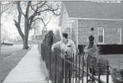  ?? ZBIGNIEW BZDAK/CHICAGO TRIBUNE ?? Kimberly Ramirez-Mercado, left, with wife Kathryn Ramirez-Mercado, collect soil samples around their house on Harding Avenue in Little Village, with the former Crawford Power Generating Station in the background.