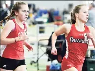  ?? Peter Hvizdak / Hearst Connecticu­t Media ?? Greenwich’s Mari Noble and Conard’s Chloe Scrimgeour compete in the 3200-meter run during the CIAC State Open Indoor Track Championsh­ip Saturday at the Floyd Little Athletic Center in New Haven.