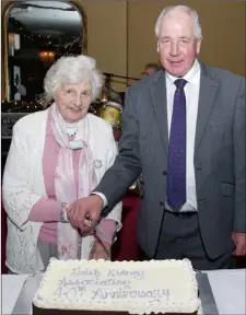  ??  ?? Annie Bolger and Liam Butler cut the 40th Anniversar­y cake.