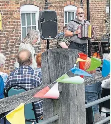  ?? PHOTO: JANET RICHARDSON ?? Music on the decking of the Navigation Warehouse in Louth.