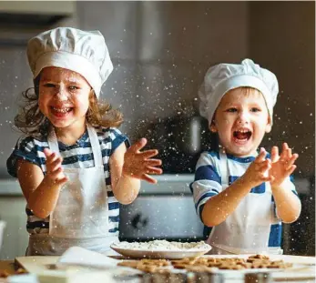  ??  ?? COOKING FUN: Combine learning with fun and a tasty treat for a result and bake with your children. PHOTO: EVGENYATAM­ANENKO