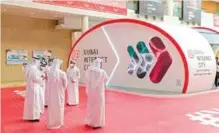  ??  ?? Below: Visitors at the Dubai Internet City stand