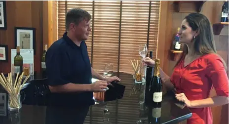  ?? DAVE MCINTYRE FOR THE WASHINGTON POST ?? Winemaker Jonathan Wheeler, left, and general manager Kerry Woolard taste Trump wines at the winery’s tasting room near Charlottes­ville, Va.