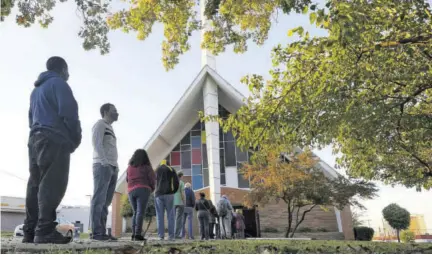  ?? (Photo: AP) ?? In this Tuesday, November 3, 2020 file photo, voters line up outside Vickery Baptist Church waiting to cast their ballots on election day in Dallas. In Georgia, faith leaders are asking corporate executives to condemn laws restrictin­g voting access — or face a boycott. In Arizona and Texas clergy have assembled outside the state capitols to decry what they view as voter-suppressio­n measures targeting black and hispanic people.