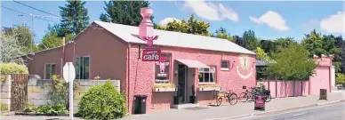  ??  ?? The bright pink Flying Pig Cafe is hard to miss in the South Island town of Duntroon.