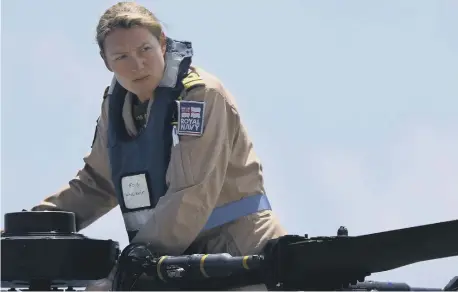  ?? ?? Lt Cdr Amy Gilmore carrying out pre-flight checks on the Wildcat; below top, Commodore Mel Robinson ADC; below middle, HMS Defender.