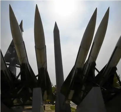  ?? —AFP ?? WARMEMORIA­L DISPLAY Replicas of a North Korean Scud-B missile (center) and South Korean Hawk surface-to-air missiles are displayed at the Korean WarMemoria­l in Seoul.