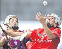  ??  ?? Wexford captain Kate Kelly and Cork’s Jennifer O’Leary tussle for possession in Saturday’s All-Ireland semi-final in Thurles.