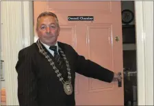  ??  ?? Mallow Town Major Cllr. Johnny ‘Bottles’ Griffin closing the door of Mallow Town Council Chamber for the final time in May 2014.