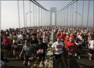  ?? RICHARD DREW — ASSOCIATED PRESS FILE ?? In a Nov. 6, 2005, photo, runners cross the upper level of the Verrazano Bridge at the start of the 36th New York City Marathon.