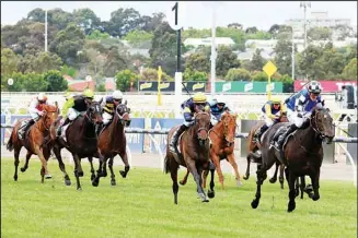  ?? ?? Jockey Mark Zahra rides Gold Trip (right), leads while approachin­g the finish to win the Melbourne Cup horse race in Melbourne, Australia. (AP)