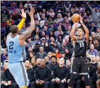  ?? Sara Nevis
/ snevis@sacbee.com ?? Sacramento Kings forward Keegan Murray (13) shoots a jumper over Memphis Grizzlies forward Xaviertill­man (2) in the second half in the NBA basketball game Monday at the Golden 1 Center in Sacramento. Murray had 20 points and nine rebounds.the Kings won 133-100.