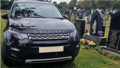  ??  ?? Disrespect­ful: The Land Rover was parked across four graves while a burial took place