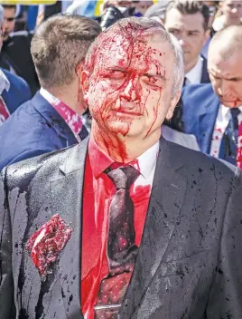  ?? Picture: AFP ?? ATTACKED. Russian ambassador to Poland Sergei Andreev after being covered with a red substance during a protest prior to a ceremony at the Soviet soldier war mausoleum in Warsaw, Poland, yesterday.