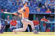  ?? CHARLIE RIEDEL/ASSOCIATED PRESS ?? Kyle Tucker of the Astros hits a two-run homer during the eighth inning of Houston’s victory Sunday at Kansas City. The Astros completed a three-game sweep of the Royals.