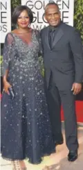  ??  ?? Viola Davis in a Marchesa tulle ball gown, with Julius Tennon.