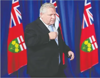  ?? NATHAN DENETTE / THE CANADIAN PRESS ?? Ontario Premier Doug Ford, who has said his decisions are based on the advice of health experts, announced a sweeping provincial shutdown on Monday. Some say it was not needed, others say it should have been done sooner.