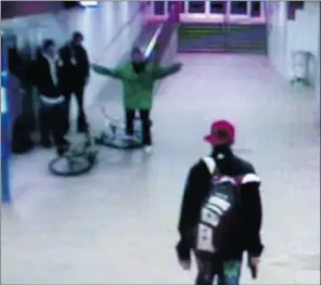  ?? Supplied ?? A screen capture taken from a video from security cameras in the Stadium LRT station shows a fatal confrontat­ion that ended with the death of Heather Rae Thurier, wearing the green jacket. To watch footage from the surveillan­ce video, go to...