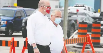  ?? DAN JANISSE ?? Mayor Drew Dilkens, left, and Premier Doug Ford tour the city’s public works yard during Ford’s visit to Windsor on Thursday, during which he announced his support for a new hospital for the city.