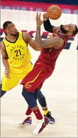  ?? Associated Press photo ?? Cleveland Cavaliers forward LeBron James (23) loses the ball as Indiana Pacers forward Thaddeus Young (21) defends during the second half of Game 3 of an NBA basketball first-round playoff series in Indianapol­is, Friday. The Pacers won 92-90 to take a...