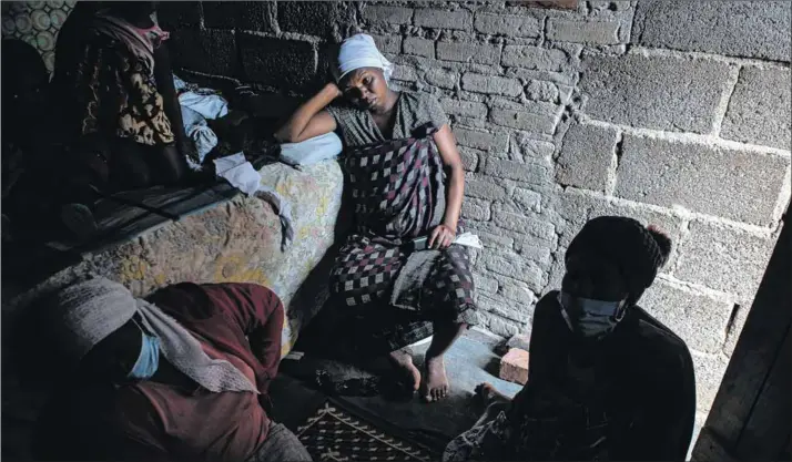  ?? Photo: Tafadzwa Ufumeli/getty Images ?? Labour: A pregnant woman at the Harare home of midwife Angeless Kanzara. Zimbabwe’s health system has been affected by the economic crisis.