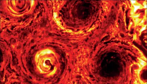  ??  ?? A new smaller cyclone can be seen at the lower right of this infrared image of Jupiter’s south pole, taken on 4 November 2019.