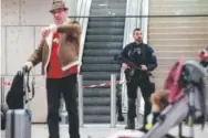  ??  ?? A riot police officer patrols inside Orly airport, south of Paris, as flights begin to resume Saturday after French soldiers shot and killed a man who wrestled a colleague to the ground and tried to steal her rifle.