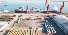  ??  ?? View of a port in Lianyungan­g, east China’s Jiangsu province. The trade war between the US and China shows little sign of abating.