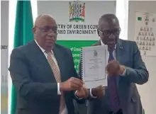  ?? Picture By Gideon Nyendwa ?? ZEMA Board Chairperso­n Professor Lovejoy Malambo with Minister of Green Economy and Environmen­t, Collins Nzovu after signing the performanc­e contracts in Lusaka yesterday.