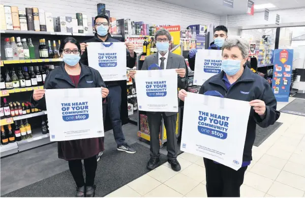  ??  ?? Community minded One Stop Shop owner Manzoor Ahmad (centre) with Imran Omar, Irfan Ali Ahmed, Colleen Napier and Kalsoom Akhtar