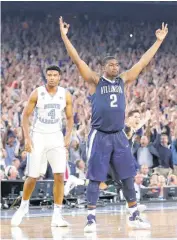  ??  ?? Villanova’s Kris Jenkins celebrates after hitting the game-winning shot Monday night to defeat North Carolina in Monday night’s NCAA title game.