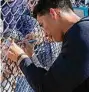  ?? David J. Phillip/Associated Press ?? The New York Yankees’ Oswaldo Cabrera signs an autograph during a spring training workout in Tampa, Fla.