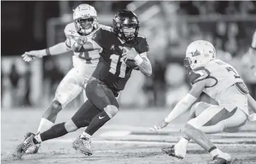  ?? WILLIE J. ALLEN JR. AP ?? Sophomore quarterbac­k Dillon Gabriel paces the UCF offense, throwing for 3,353 yards on a 61.7 percent completion rate with 30 touchdowns against four intercepti­ons.