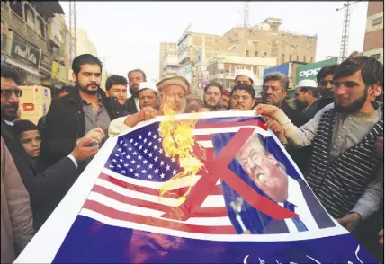  ?? AP photo ?? Pakistani traders protest against U.S. President Donald Trump in Peshawar, Pakistan. A senior Pakistani senator has expressed disappoint­ment at the U.S. decision to suspend military aid to Islamabad, saying it will be detrimenta­l to Pakistani-u.s....