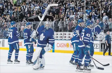  ?? CHRIS YOUNG THE CANADIAN PRESS ?? Toronto Maple Leafs goaltender Frederik Andersen raises his stick Saturday to acknowledg­e the crowd after a 4-2 victory over the Montreal Canadiens.