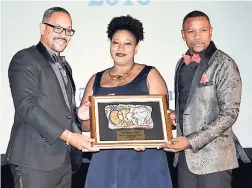  ??  ?? The Gleaner Company (Media) Limited’s managing director, Christophe­r Barnes (left) presents the ‘Most Eco/Sustainabl­e Hotel’ award to Half Moon’s Arlien Dyer and Conroy Thompson.