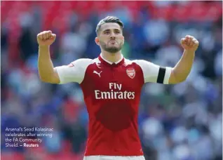  ?? — Reuters ?? Arsenal’s Sead Kolasinac celebrates after winning the FA Community Shield.