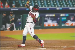  ?? The Associated Press ?? ACUNA BEANED AGAIN: Atlanta Braves’ Ronald Acuna Jr. (13) is hit by a pitch by Miami Marlins starting pitcher Sandy Alcantara Tuesday during the third inning in Game 1 of a National League Division Series in Houston.